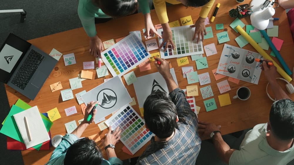 Graphic designers finding colors to make a logo