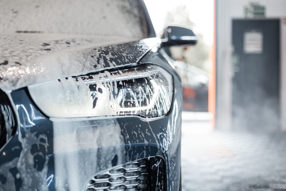 A soapy car being washed